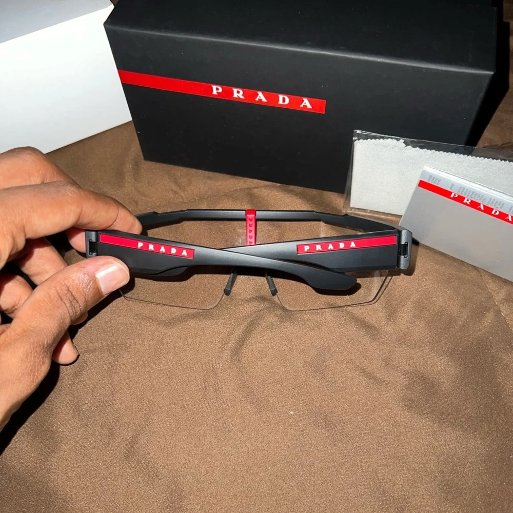 Prada Black Sunglasses with Red Accent Rimless Shield